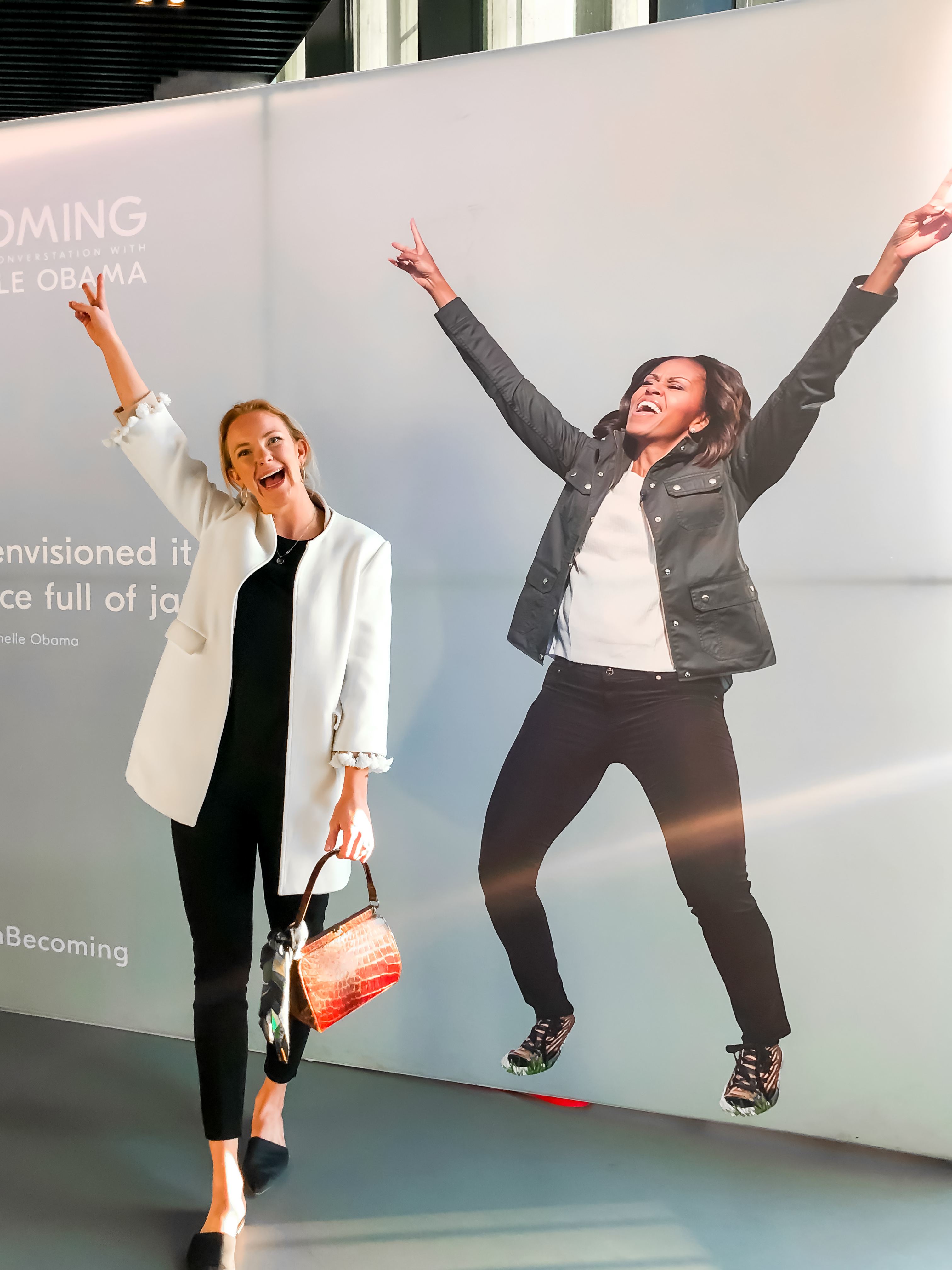 Posing next to an excited Michelle Obama on a poster at her Copenhagen stop on the Becoming Book Tour
